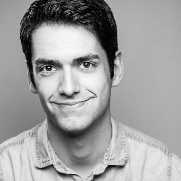 Black and white headshot photograph of Chris Guard